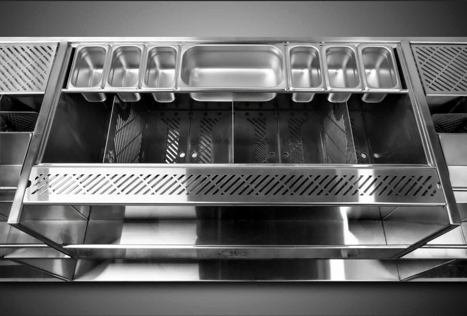 Insulated ice chest with garnish rail on stainless steel cocktail station